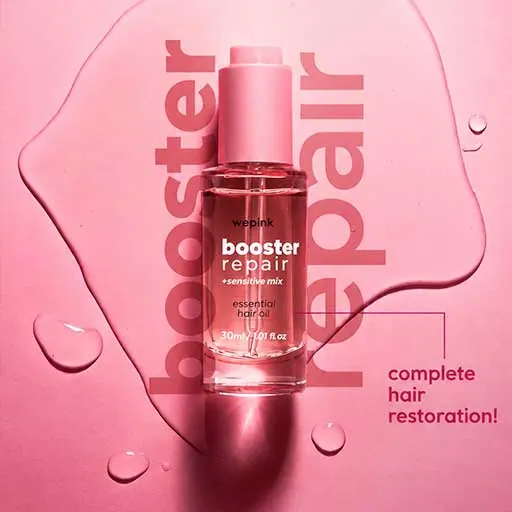 Wepink booster repair hair oil bottle on a pink background